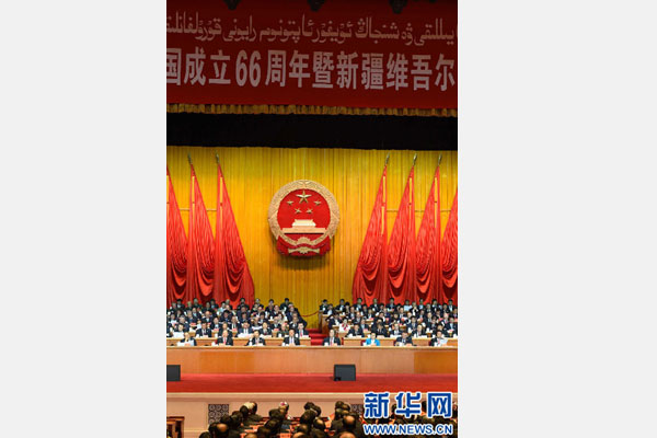 10月1日，慶祝中華人民共和國成立66周年暨新疆維吾爾自治區(qū)成立60周年大會(huì)在新疆人民會(huì)堂隆重舉行。 新華社記者 高潔 攝 